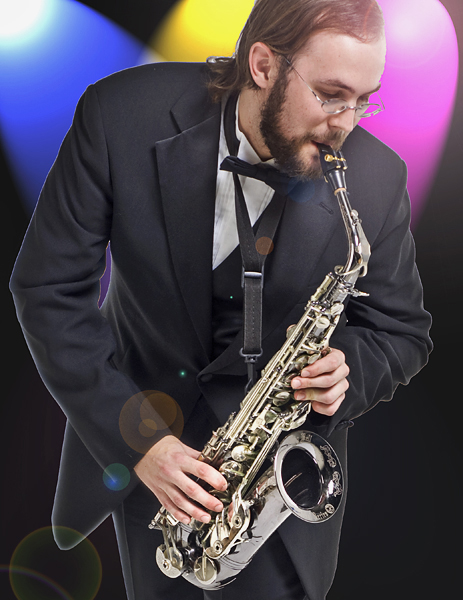 Photoshopped image of man playing saxophone "in front of" blue, yellow, and magenta stage lights.