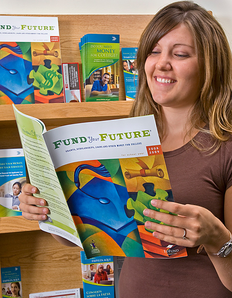 Woman in brown shirt standing to right, reads "Fund Your Future" brochure and smiles.