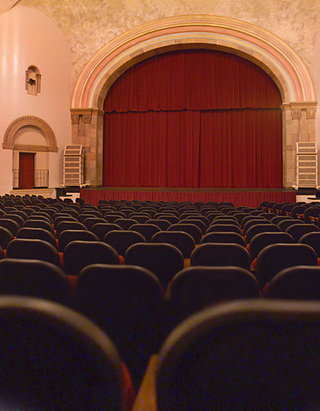 Empty seats fill the vast campus entertainment and performance venue, Laxson Hall. 