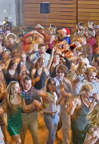 Motion is captured as couples move in unison in a dance class or competition taking place in Acker Gymnasium.