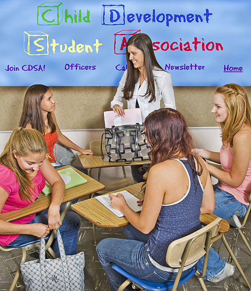 Woman prepares to sit with four young women in a group of desks with Child Development Student Association sign on wall behind them.