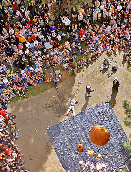 A huge crowd of school-aged children and college-aged young adults has gathered to watch what happens when pumpkins are dropped from the sixth floor of Butte Hall. One guess...SPLAT.