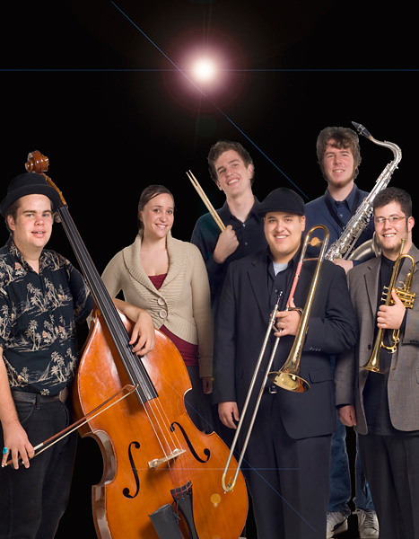 Six people stand holding instruments, posed against a black background and a PhotoShopped lens flare. (L-R) Standing bass, drum sticks, trombone, sax, & trumpet.